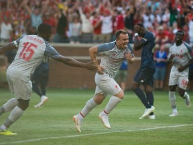 Liverpool's Xherdan Shaqiri celebrates scoring against Manchester United at Michigan Stadium. Reuters