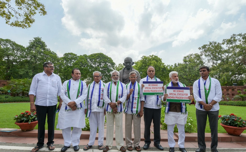 YSR Congress Party members protest for special status to Andhra Pradesh at Parliament House on the second day of the Monsoon Session, in New Delhi on Thursday. PTI