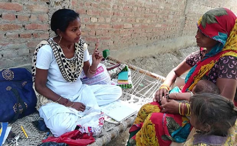 ANM Archana counselling a mother after immunisation at Badnamo village in Farrukhabad district in central Uttar Pradesh.