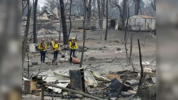 California wildfires: Thousands more flee; crews handling blaze near Redding hopeful after massive fire slows down