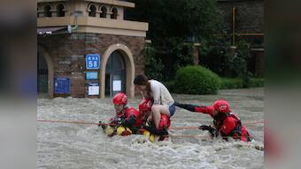 China floods kill 15 people, force more than 80,000 to evacuate; authorities issue warning as more rainfall expected