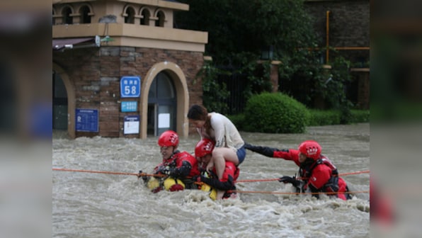 China floods kill 15 people, force more than 80,000 to evacuate; authorities issue warning as more rainfall expected