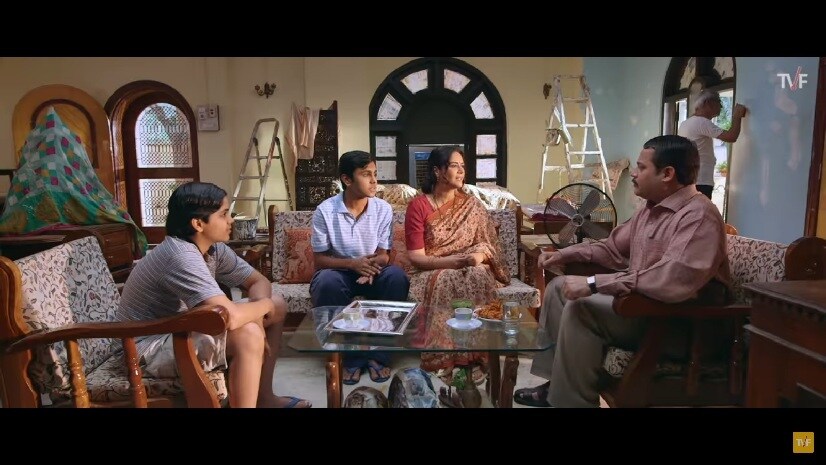 Harshu (left) looks on powerless as the trio decide his fate. YouTube screengrab