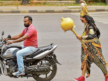 Bengaluru Traffic Police deploys 'Yamaraja' on streets to warn people about violations, spread road safety awareness Bengaluru Traffic Police deploys 'Yamaraja' on streets to warn people about violations, spread road safety awareness