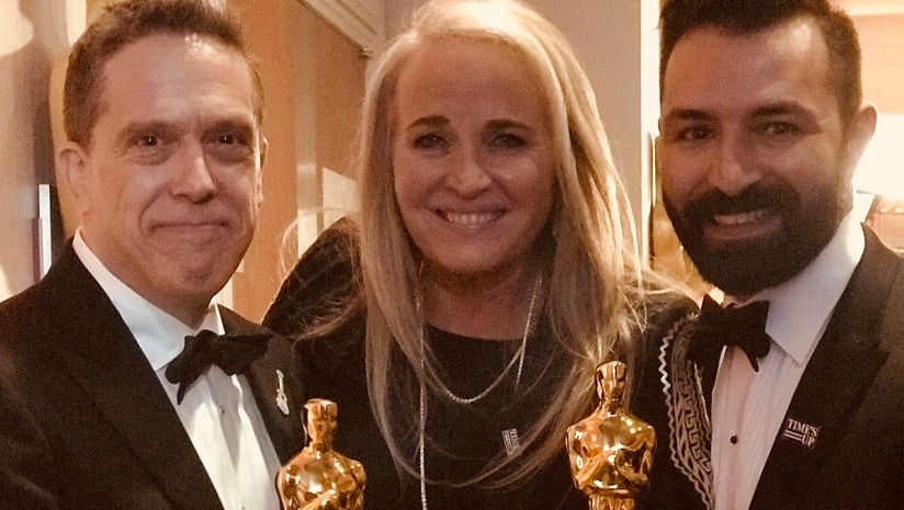 Adrian Molina (right) with Lee Unkrich(left) and producer Darla K. Anderson (centre) after winning the Oscar for Best Animated Feature. Image from Twitter/ @AdrianTheMolina