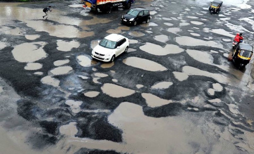 From planting rice saplings to swimming in potholes: Here's how Indians protest against bad roads From planting rice saplings to swimming in potholes: Here's how Indians protest against bad roads