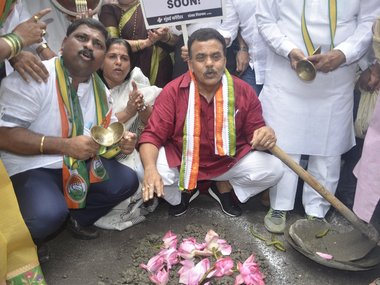 Congress workers in Mumbai fill potholes, accuse civic body of lack of preparedness for monsoon Congress workers in Mumbai fill potholes, accuse civic body of lack of preparedness for monsoon