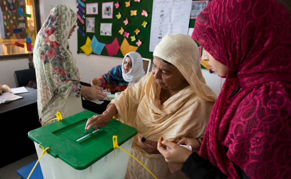 A woman casts her vote at a polling station for the Parliamentary elections in Islamabad. While ECP suspended polling in eight constituencies — two of the National Assembly and six of provincial assemblies — for various reasons. AP A woman casts her vote at a polling station for the Parliamentary elections in Islamabad. While ECP suspended polling in eight constituencies — two of the National Assembly and six of provincial assemblies — for various reasons. AP