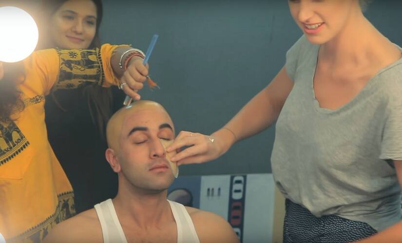Ranbir Kapoor being prepped to look like Sanjay Dutt. Screengrab from YouTube