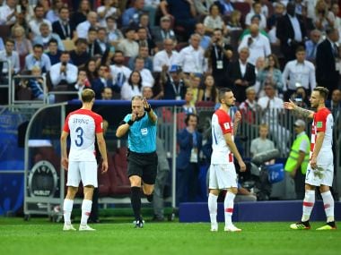 Referee Nestor Pitana calls for a penalty after a VAR review during the World Cup final. Reuters