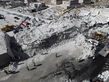 Toll in arms depot explosion in Syria's Idlib rises to 69; monitor says most casualties civilians, including 17 children Toll in arms depot explosion in Syria's Idlib rises to 69; monitor says most casualties civilians, including 17 children