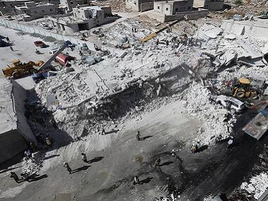 Toll in arms depot explosion in Syria's Idlib rises to 69; monitor says most casualties civilians, including 17 children