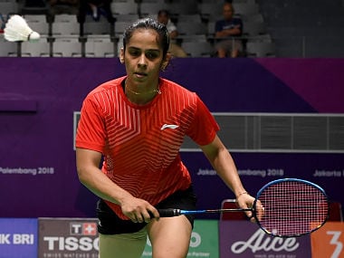 India's Saina Nehwal eyes the shuttlecock against Japan's Nozomi Okuhara in their women's singles match in the womens team quarter-final badminton competition at the 2018 Asian Games in Jakarta on August 20, 2018. / AFP PHOTO / SONNY TUMBELAKA