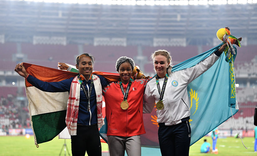 (Friom Left to Right) Silver medallist India's Hima Das, gold medallist Bahrain's Naser Salwa and bronze medallist Kazakhstan Elina Mikhina. AFP