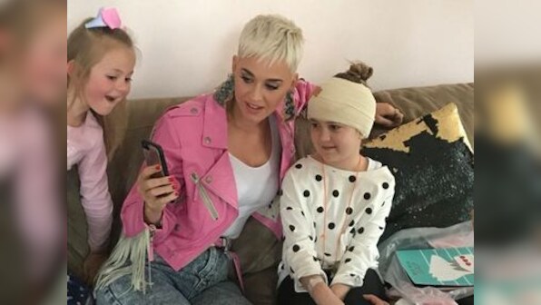 Katy Perry surprises young brain tumour survivor  in Australia after viral Twitter campaign