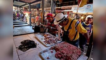 Residents buy spoiled meat after fire destroys main power line in Venezuela's Maracaibo; country facing worst-ever economic downfall