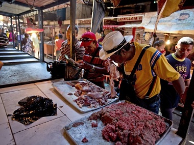 Residents buy spoiled meat after fire destroys main power line in Venezuela's Maracaibo; country facing worst-ever economic downfall Residents buy spoiled meat after fire destroys main power line in Venezuela's Maracaibo; country facing worst-ever economic downfall