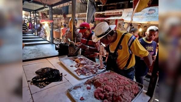 Residents buy spoiled meat after fire destroys main power line in Venezuela's Maracaibo; country facing worst-ever economic downfall