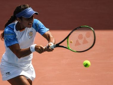 India's Ankita Raina hits a return during the 2018 Asian Game. AFP