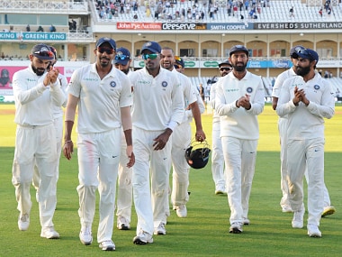 Indian cricketers applaud Jasprit Bumrah, front, who took five wickets, as they walk back to the pavilion at the end of the fourth day of the third cricket test match between England and India at Trent Bridge in Nottingham, England, Tuesday, Aug. 21, 2018. (AP Photo/Rui Vieira)
