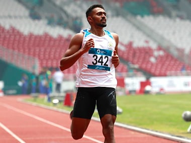 India's Muhammed Anas Yahiya crosses the finish line to win his men's 400m heat during the athletics competition at the 18th Asian Games. AP