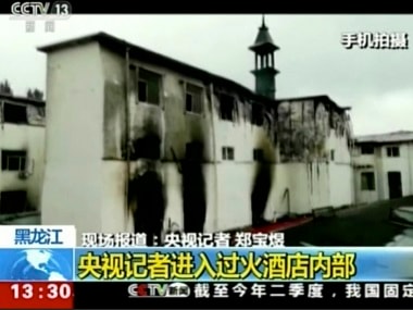 Charred portions of a hotel in China's Harbin city after a fire. AP