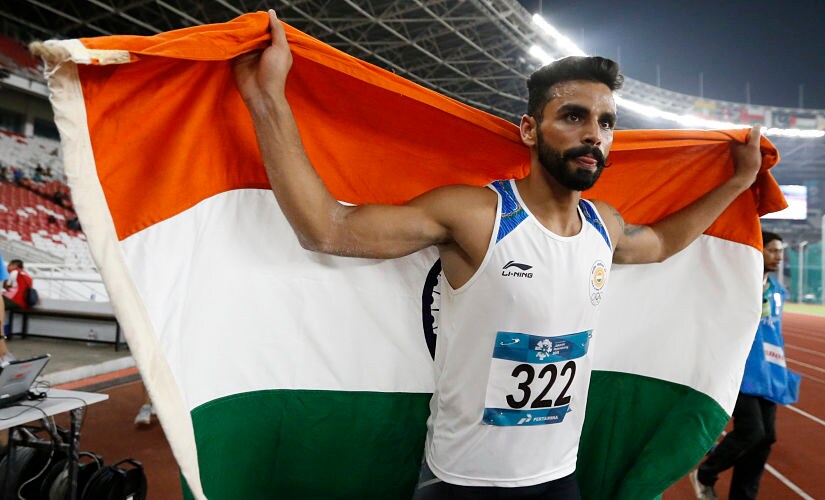 India's Arpinder Singh celebrates after winning the men's triple jump gold medal during the athletics competition at the 18th Asian Games in Jakarta, Indonesia, Wednesday, Aug. 29, 2018. (AP Photo/Dita Alangkara)