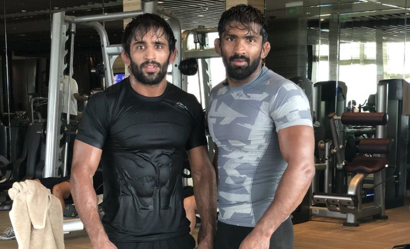 Friend, philosopher, guide, bhai, Yogeshwar Dutt's role in Bajrang's life is in line with the finest teacher-disciple tradition of Indian akhadas. Image courtesy: Twitter/ @BajrangPunia