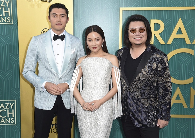 (From L-R) Henry Golding, Constance Wu and executive producer/author Kevin Kwon arrive at the premiere of Crazy Rich Asian" at the TCL Chinese Theatre in Los Angeles. Photo by Richard Shotwell/Invision/AP