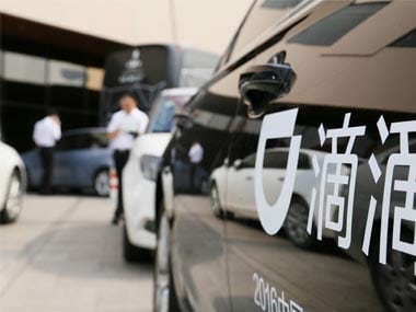 A Didi sign is seen on a car in Beijing. Reuters