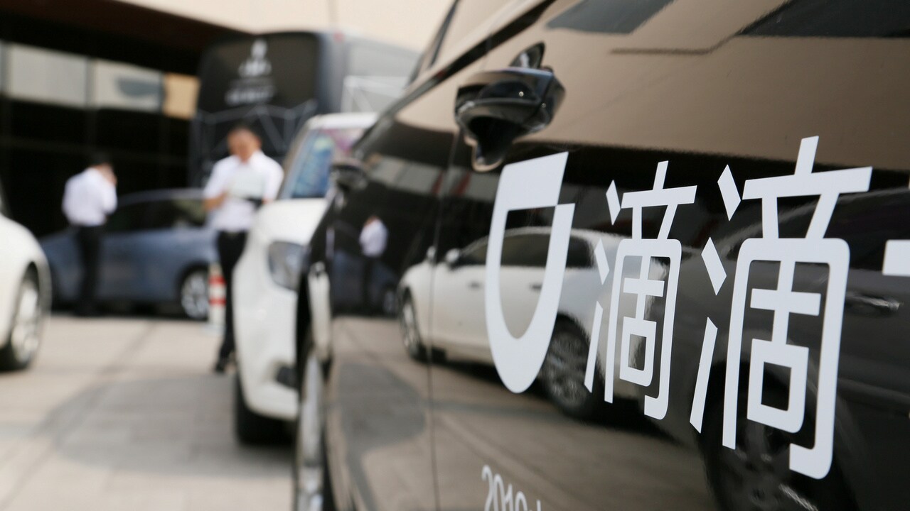 A Didi sign is seen on a car during a conference in China. Image: Reuters