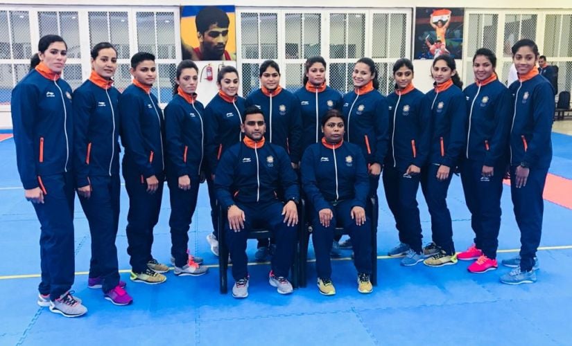 Indian women's team poses for a photo with coaches Srinivas Reddy and Banani Saha. Image Courtesy: AKFI