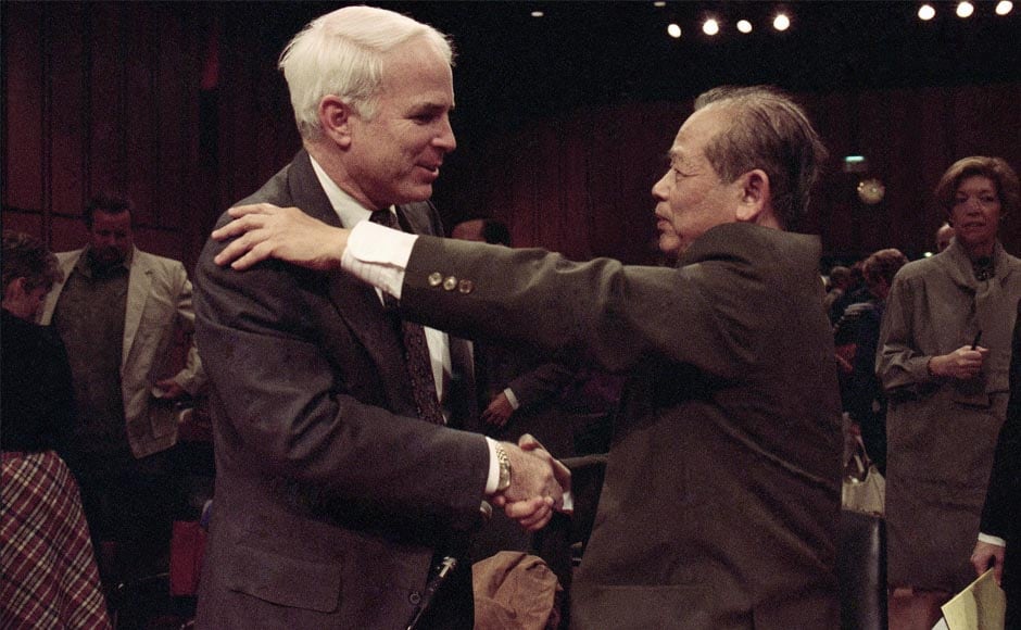 In this 7 November, 1991 file photo, McCain is hugged by former North Vietnam Colonel Bui Tin on Capitol Hill in Washington after a hearing of the Senate Select Committee on POW and MIA affairs. Tin oversaw a military prison operation dubbed the In this 7 November, 1991 file photo, McCain is hugged by former North Vietnam Colonel Bui Tin on Capitol Hill in Washington after a hearing of the Senate Select Committee on POW and MIA affairs. Tin oversaw a military prison operation dubbed the