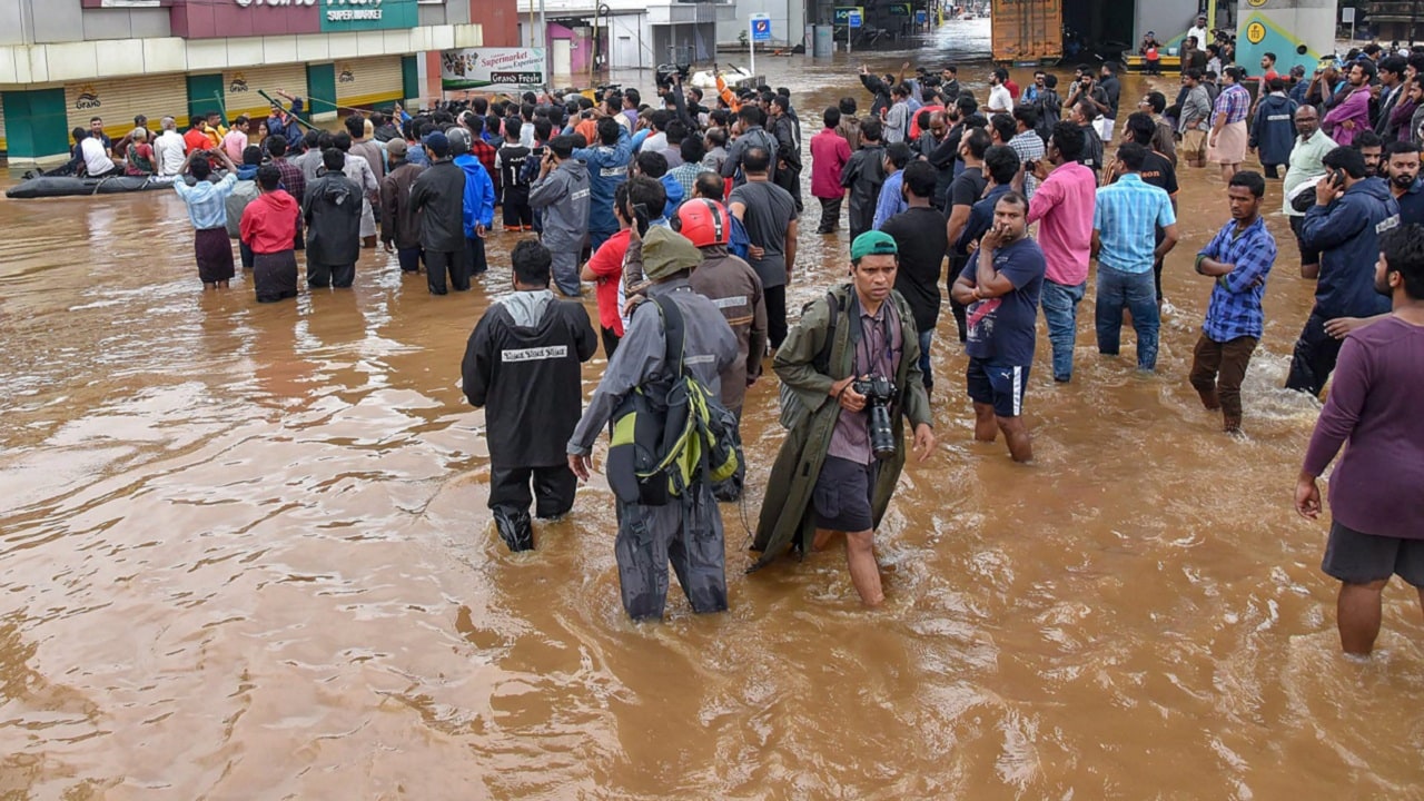 Kochi: People being rescued from a flood-affected region following heavy monsoon rainfall, in Kochi on Thursday, Aug 16, 2018. PTI