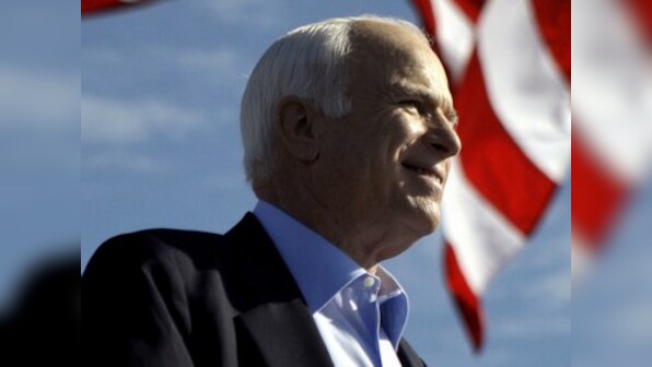 America says its final goodbye to John McCain and waits for Saturday's historic eulogy by Barack Obama and George Bush