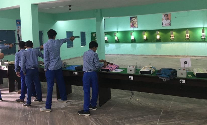 Students practice at the shooting range in Manu Bhaker's Universal Senior Secondary School. Image Courtesyu: Firstpost/ Shantanu Srivastava