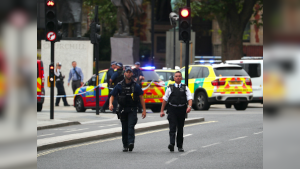 Car crashes into barriers near UK Parliament in Westminster, wounds several pedestrians; man held on suspicion of terror offences