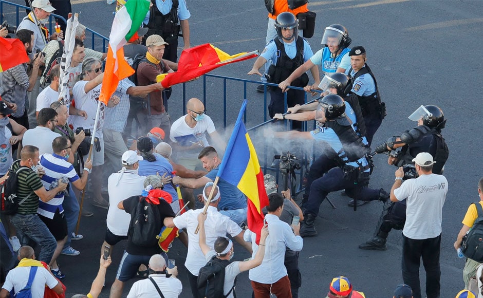 Some participants scuffled with riot police when they tried to break through a police line guarding the government offices. AP Some participants scuffled with riot police when they tried to break through a police line guarding the government offices. AP