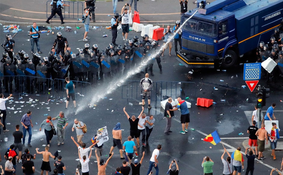 Several people were detained, and police fired tear gas multiple times. Late Friday, officers fired water cannon as well. AP Several people were detained, and police fired tear gas multiple times. Late Friday, officers fired water cannon as well. AP