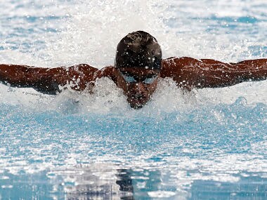 India's Sajan Prakash swims in his heat of the men's 100m butterfly during the swimming competition at the 18th Asian Games in Jakarta, Indonesia, Wednesday, Aug. 22, 2018. (AP Photo/Lee Jin-man)