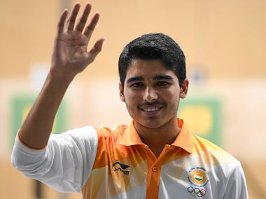 India's Saurabh Chaudhary celebrates after winning the men's 10m air pistol shooting final during the 2018 Asian Games in Palembang on August 21, 2018. / AFP PHOTO / Mohd RASFAN