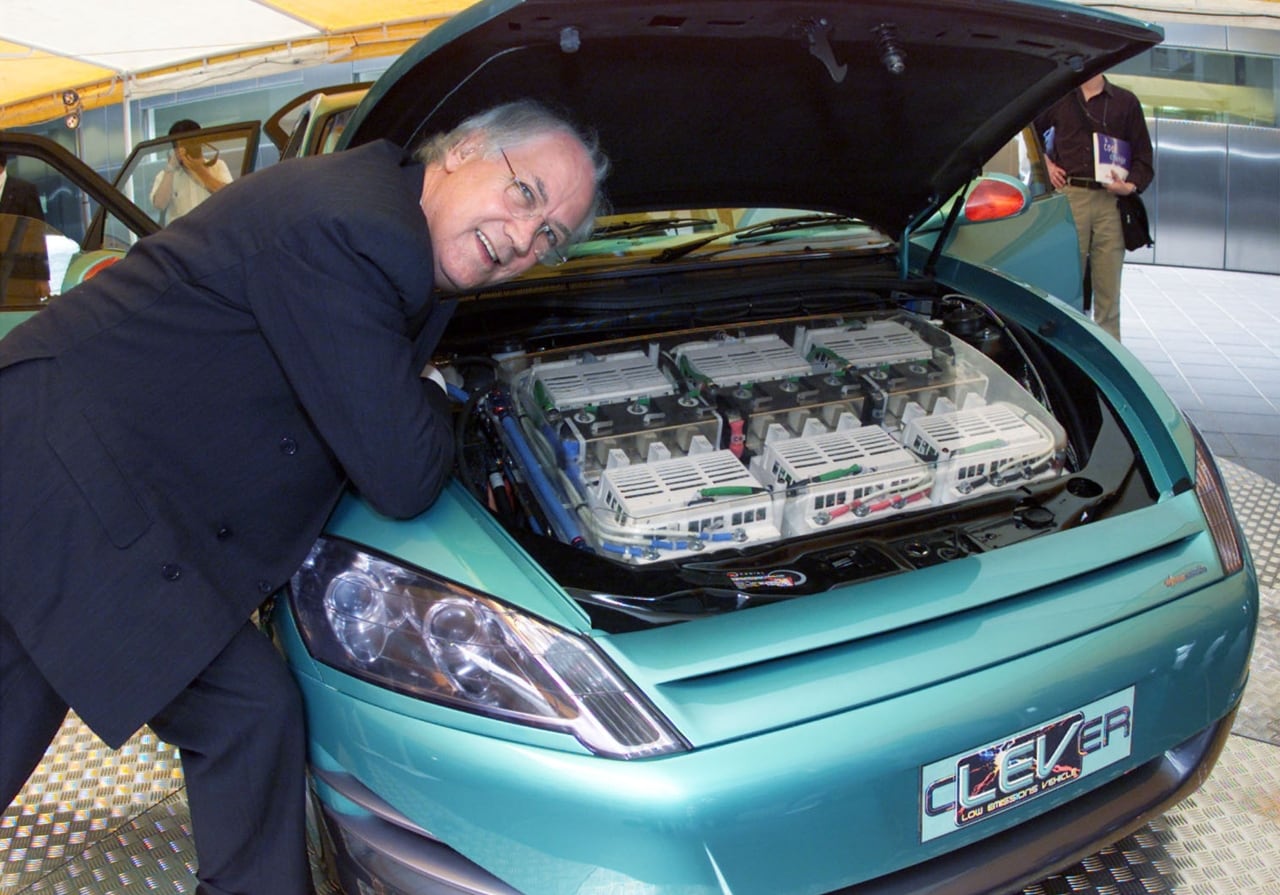 David Lamb, chairman of Axcess Australia Projects Ltd, shows off a newly developed hybrid electric vehicle in Tokyo. The energy produced by the car's generator drives a 300-volt electric motor at the front of the car, is stored in a 60-volt battery pack or a 130-volt supercapacitor pack.
