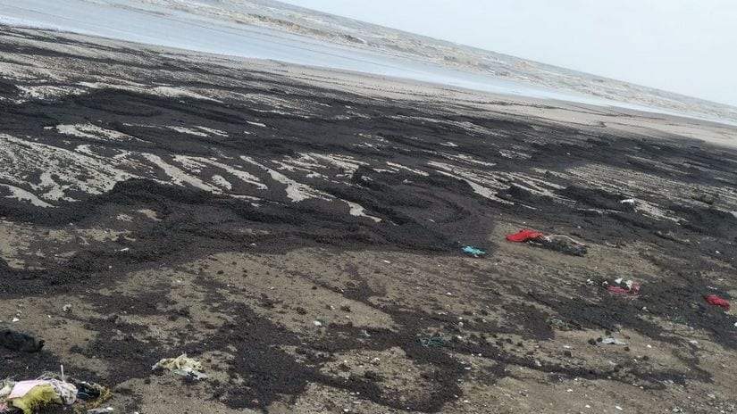 Tar balls washed up in Gujarat coast. MSH Sheikh