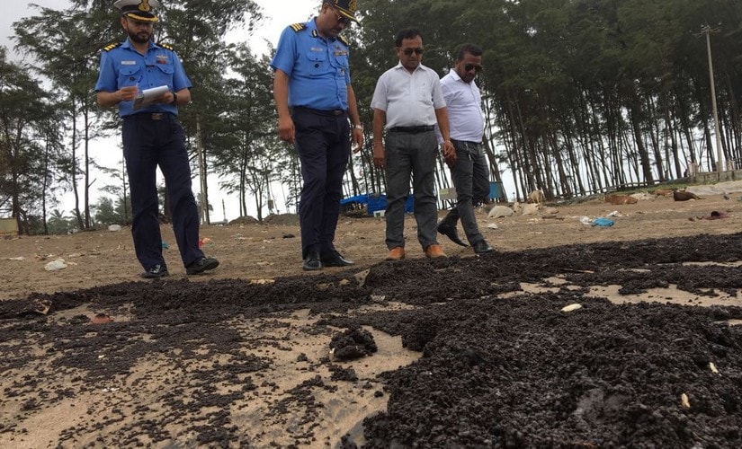 Tar balls washed up in Gujarat coast. MSH Sheikh