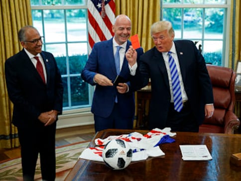 US President Donald Trump shows press red card after welcoming FIFA boss Gianni Infantino to the White House US President Donald Trump shows press red card after welcoming FIFA boss Gianni Infantino to the White House
