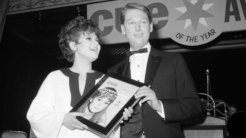 Barbara Harris, star of The Apple Tree receives Cue Magazine's "Entertainer of the Year" award from last year's winner, director Mike Nichols in New York. The Associated Press/ Marty Lederhandler