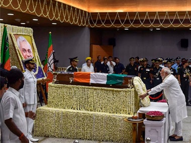 Prime Minister Narendra Modi lays a wreath on the mortal remains of former prime minister Atal Bihari Vajpayee as he pays last respects at BJP headquarters. PTI