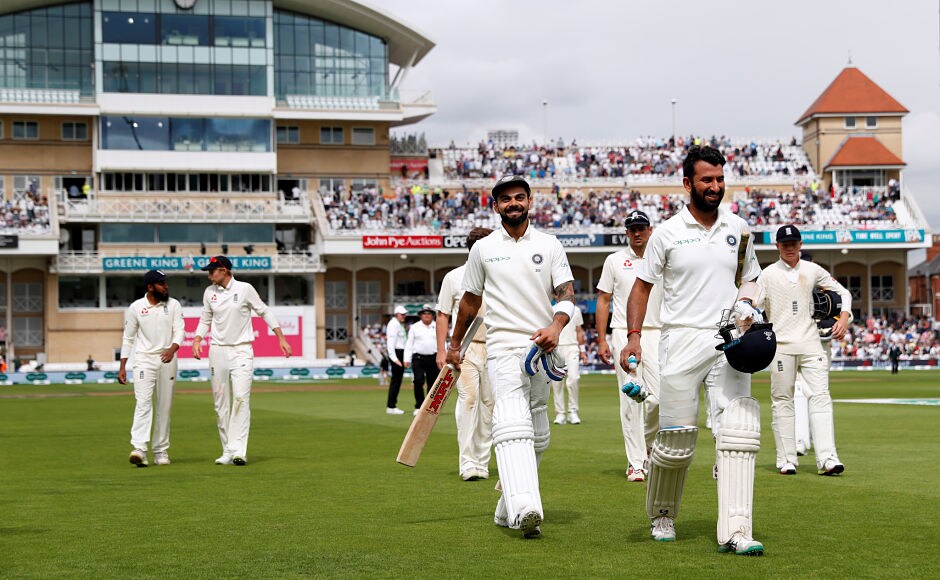 India skipper Virat Kohli and Cheteshwar Pujara leave the field after playing out the first session of the 3rd day. They stitched a 113-run stand to further extend the side's lead. Reuters India skipper Virat Kohli and Cheteshwar Pujara leave the field after playing out the first session of the 3rd day. They stitched a 113-run stand to further extend the side's lead. Reuters