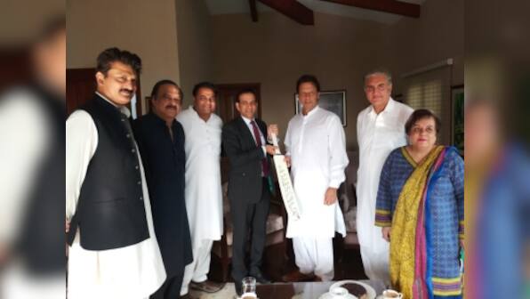 Indian High Commissioner Ajay Bisaria meets Imran Khan, gifts him cricket bat signed by Indian team
