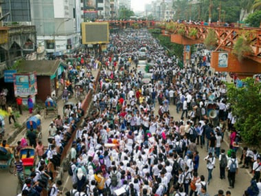 Bangladeshi students block a road during a protest in Dhaka, Bangladesh on Saturday. AP